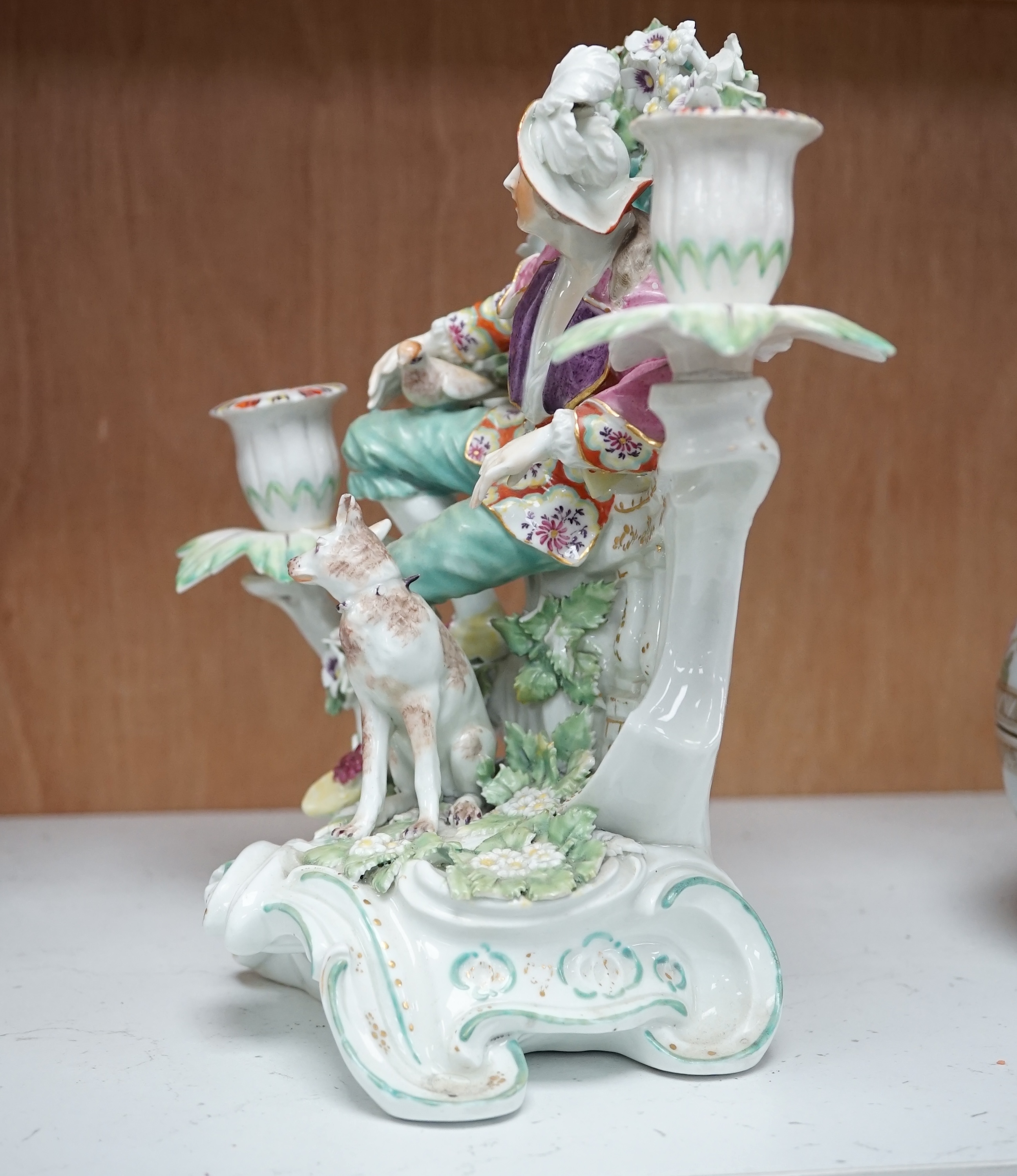 A Derby figural two-branch candelabrum, c.1775, 25cm high. Condition - poor